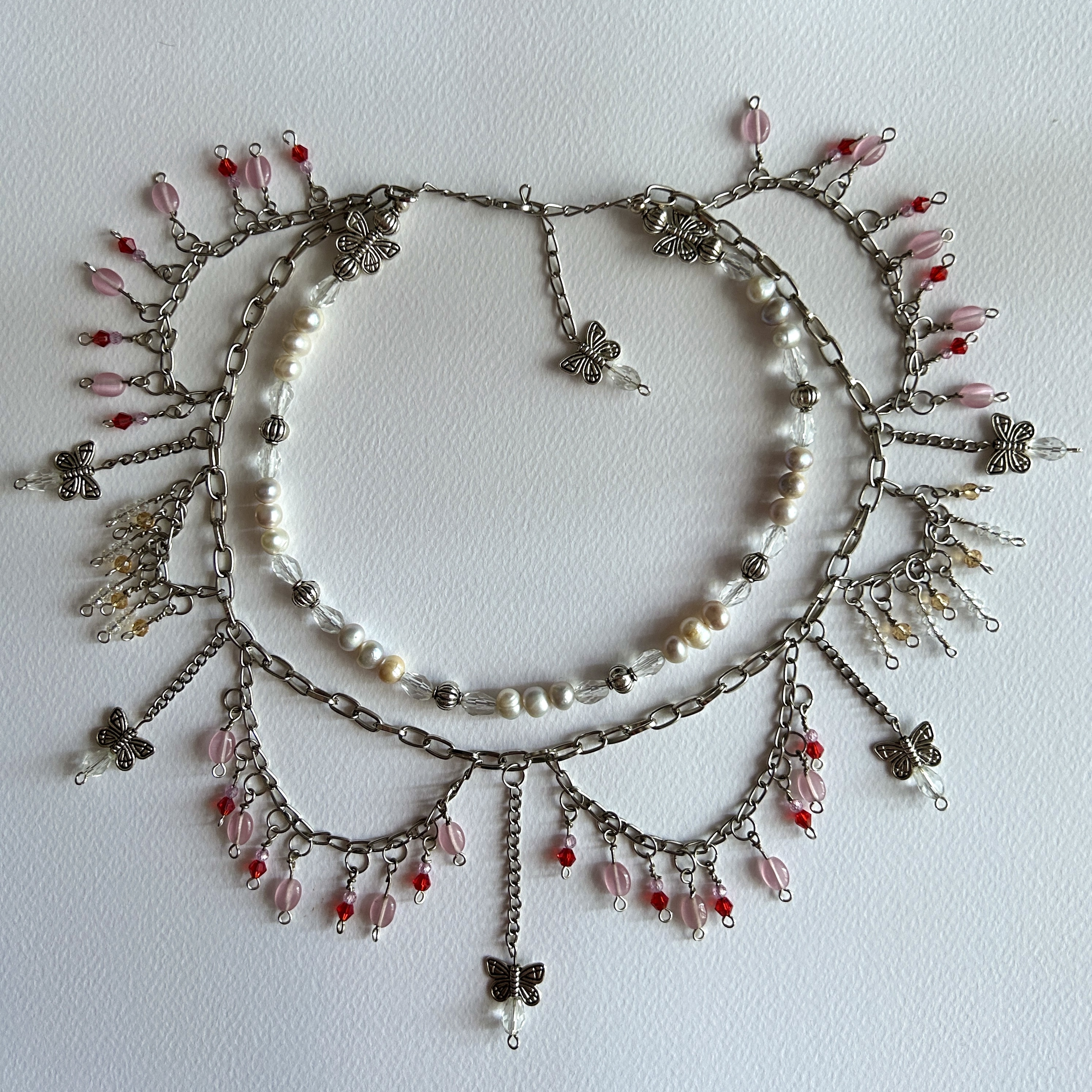 tiered beaded necklace with red and pink glass beads